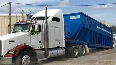 Monroe Environmental's mobile water treatment system, the X-Flo Mobile Clarifier transported on truck to jobsite